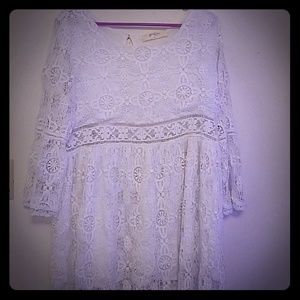 white long sleeve dress with cut out on the waist